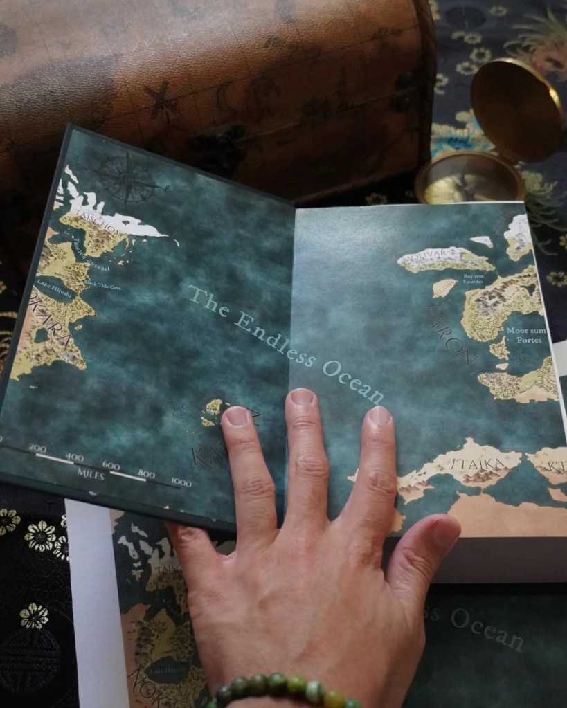 Endpaper illustration of The Tides That Reign saga fantasy world map featured in the series omnibus edition.